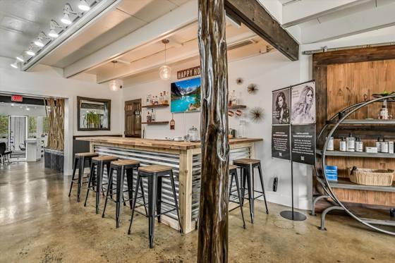 Suite 103 — beverage bar and retail wall