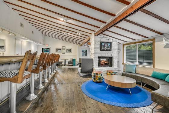 Suite 100 — lounge seating beside the bar
