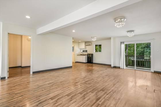 Shared reception between Suites 101 and 102, with kitchenette and deck access