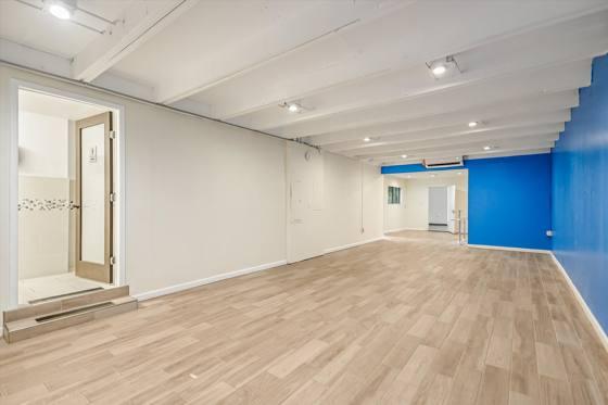 Shared space — back room with exposed ceiling structure