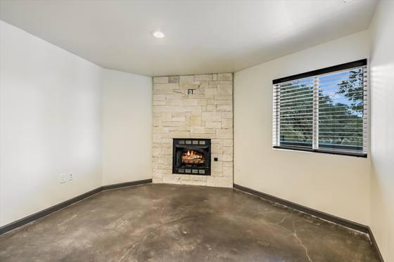 Suite G100 — office with stone fireplace