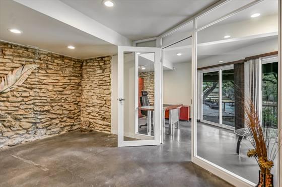 Suite G100 — glass-walled office and lounge