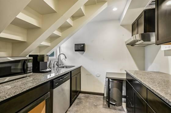 Suite G100 — kitchen with granite counters