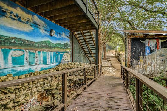 The waterfall bridge and mural walk between levels